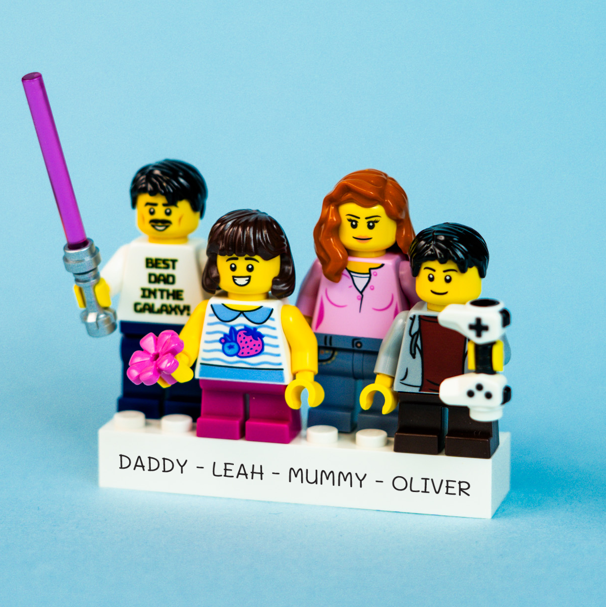 Custom LEGO brick family figures with names on a blue background